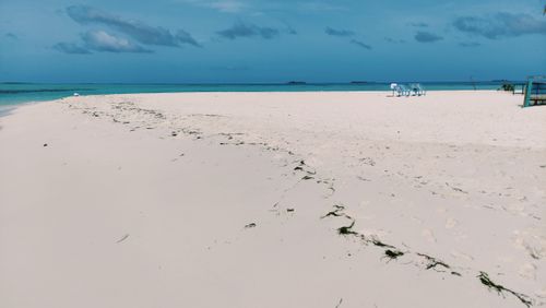Free Explore tranquility on a serene white sand beach in Dhangethi, Maldives, under a clear blue sky. Stock Photo