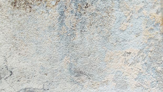 Close-up of a textured surface with gentle pastel tones, creating an abstract and artistic effect.
