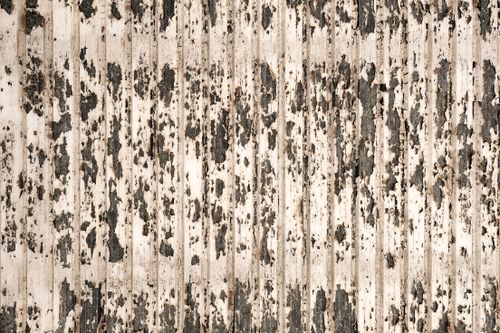 Free A close-up shot of a wooden wall with peeling paint creating a rugged texture. Stock Photo