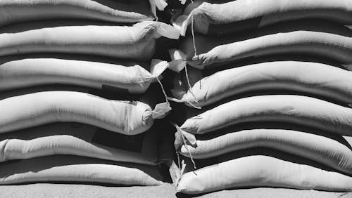 Free Grayscale Photo of Stack of Sack Stock Photo