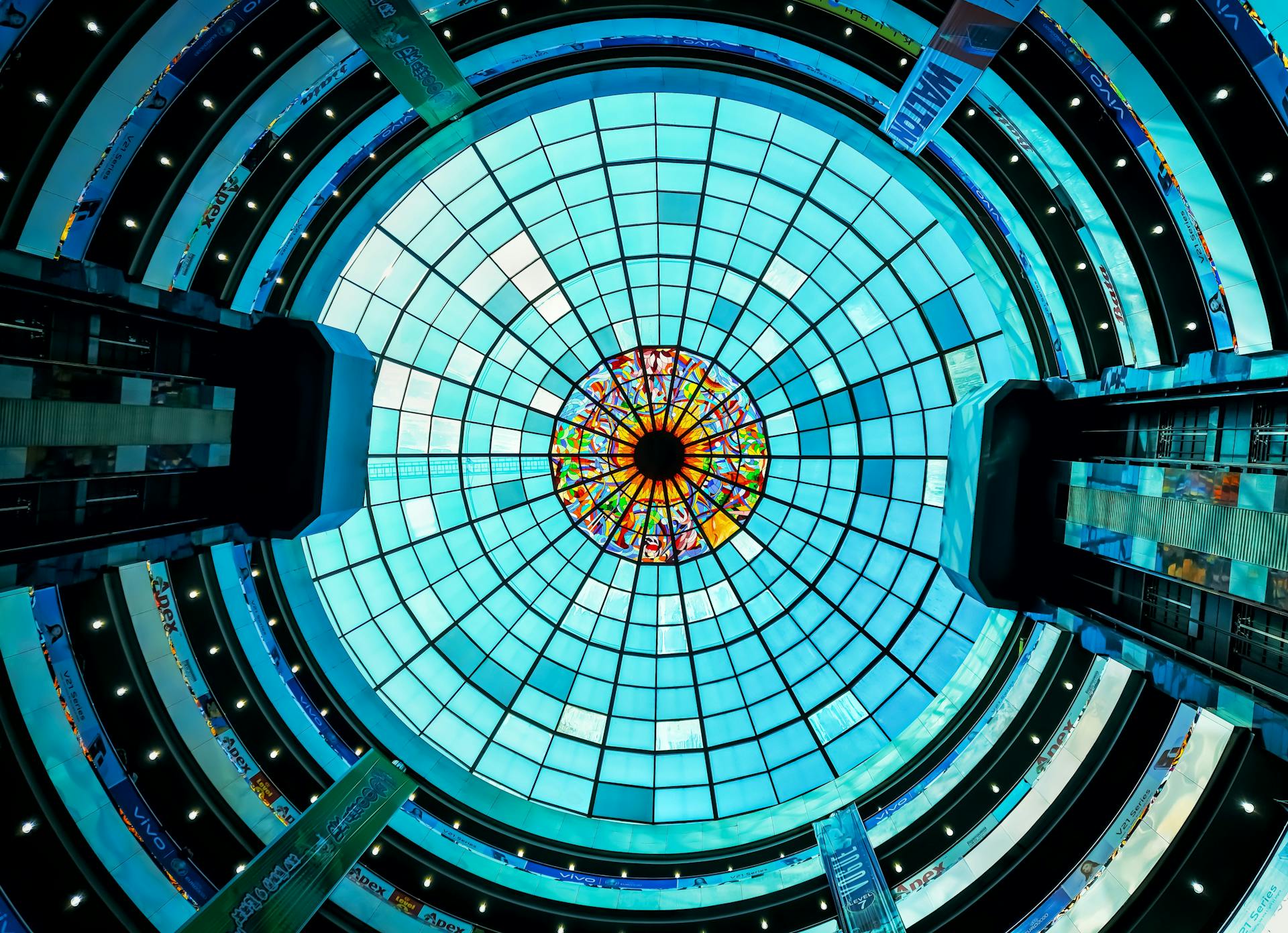 Captivating view of a modern stained glass dome inside a Dhaka building, showcasing architectural elegance.