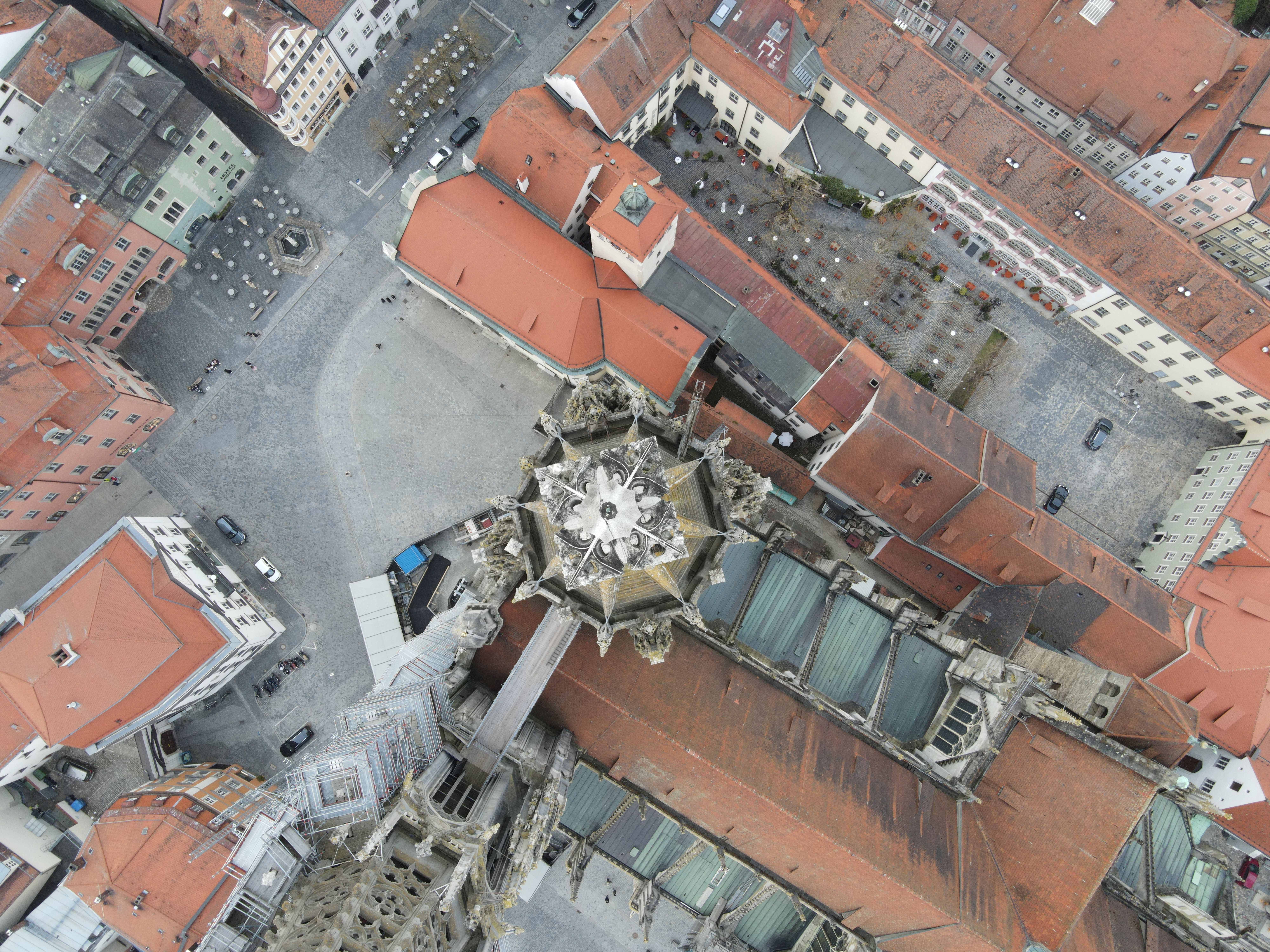 Drone view of Regensburg Cathedral in Germany showcasing architectural beauty and urban layout.