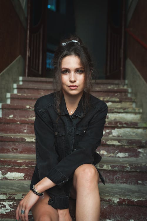 Woman Sitting on the Staircase Posing