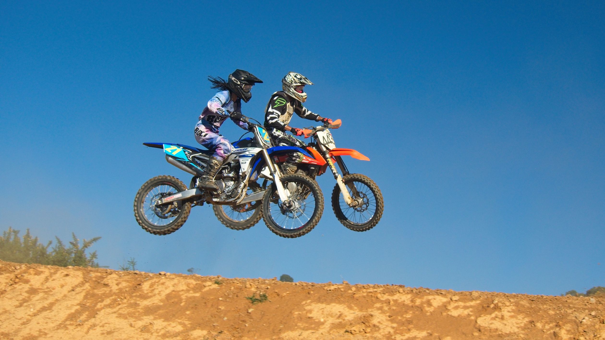 2 People Ride Motorcycle Two Person Riding Motocross Dirt Bikes · Free Stock Photo