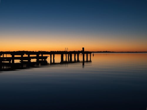 Fotos de stock gratuitas de embarcadero, puesta de sol