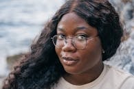 Woman in White Crew Neck Shirt Wearing Eyeglasses