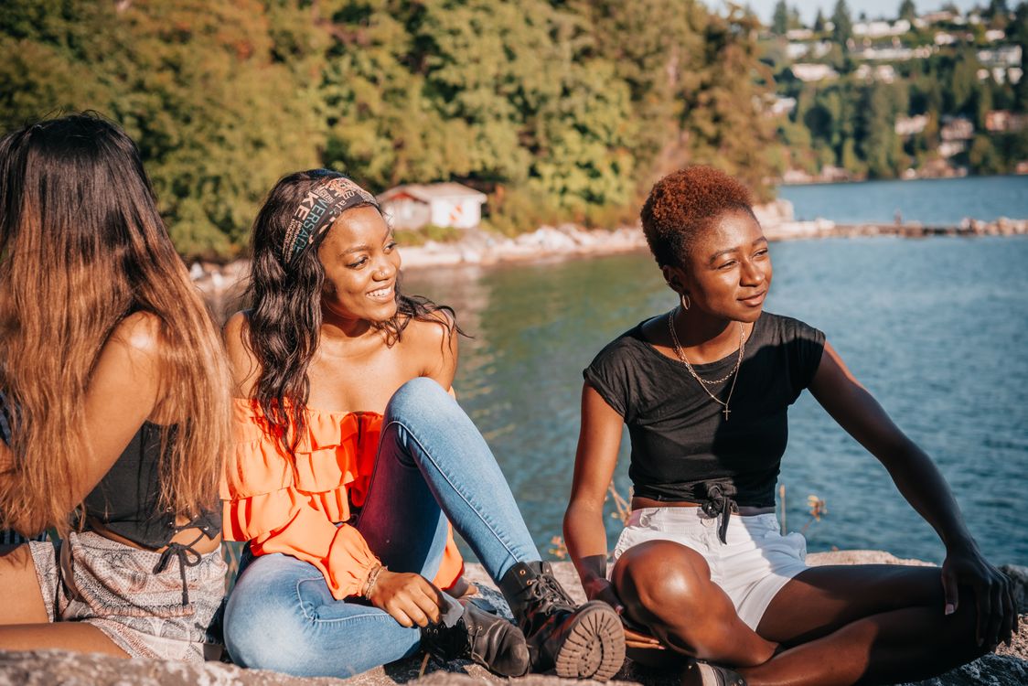 Photo of Women Sitting on the Ground · Free Stock Photo