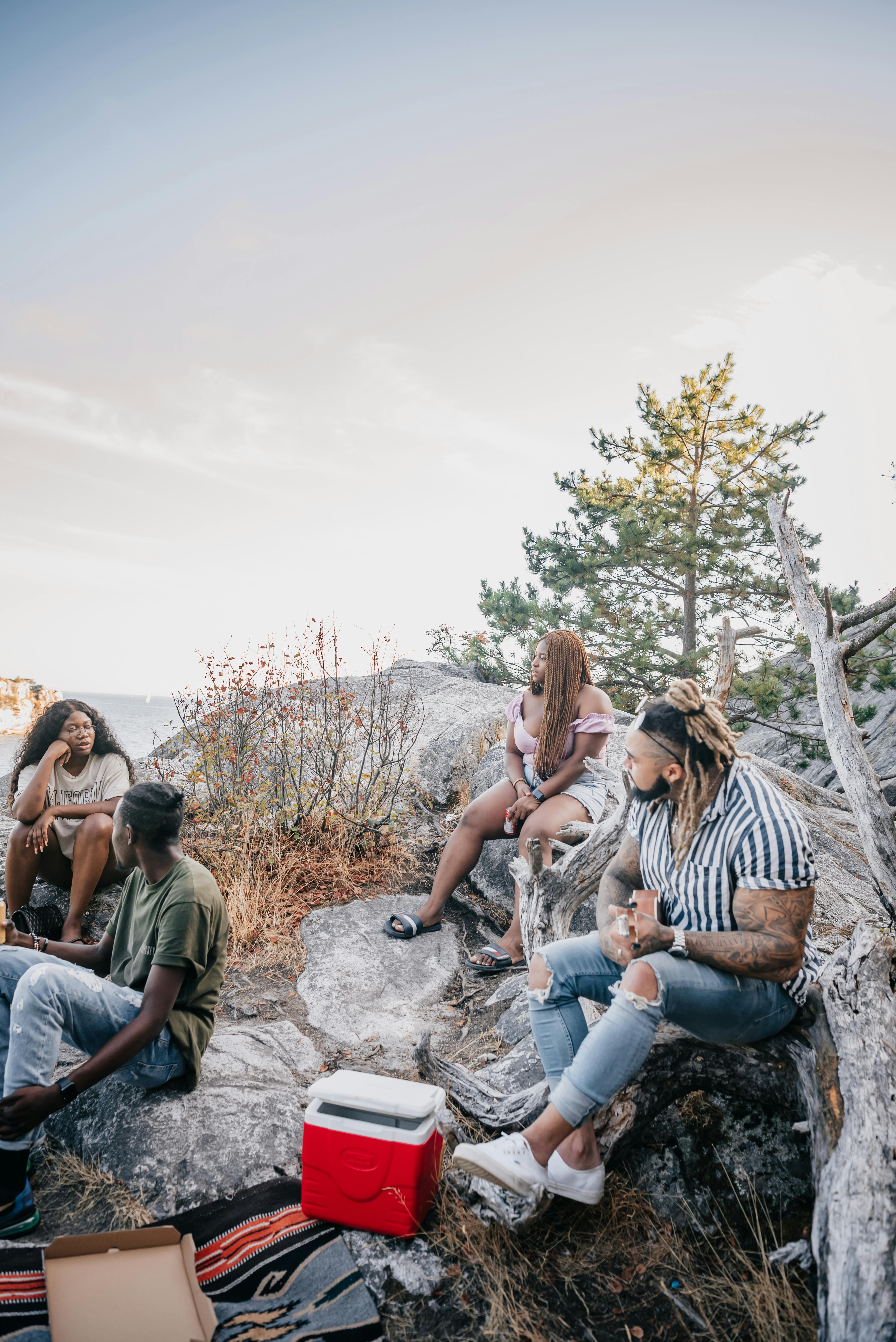 people sitting on rocks