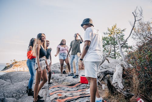 Multiracial Group of Friends Standing on Gray Rock