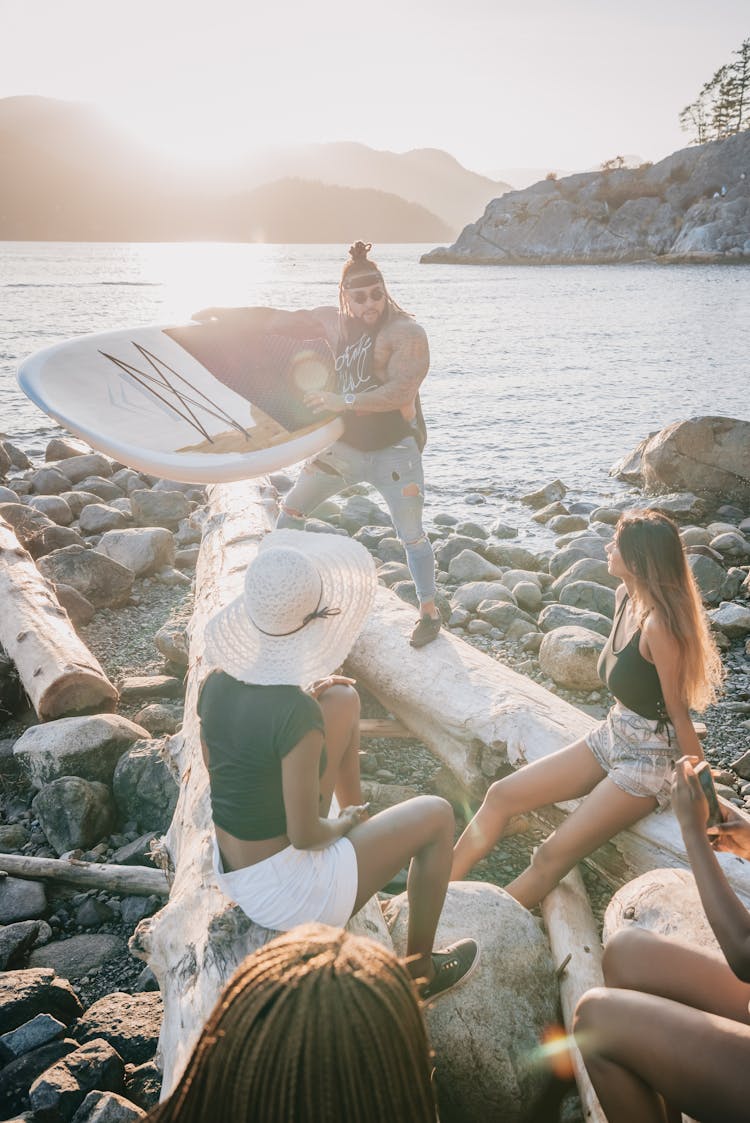 Group Of Friends Having A Party In The Beach