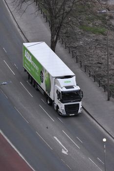 High angle view of an ASDA delivery truck driving on an urban street.