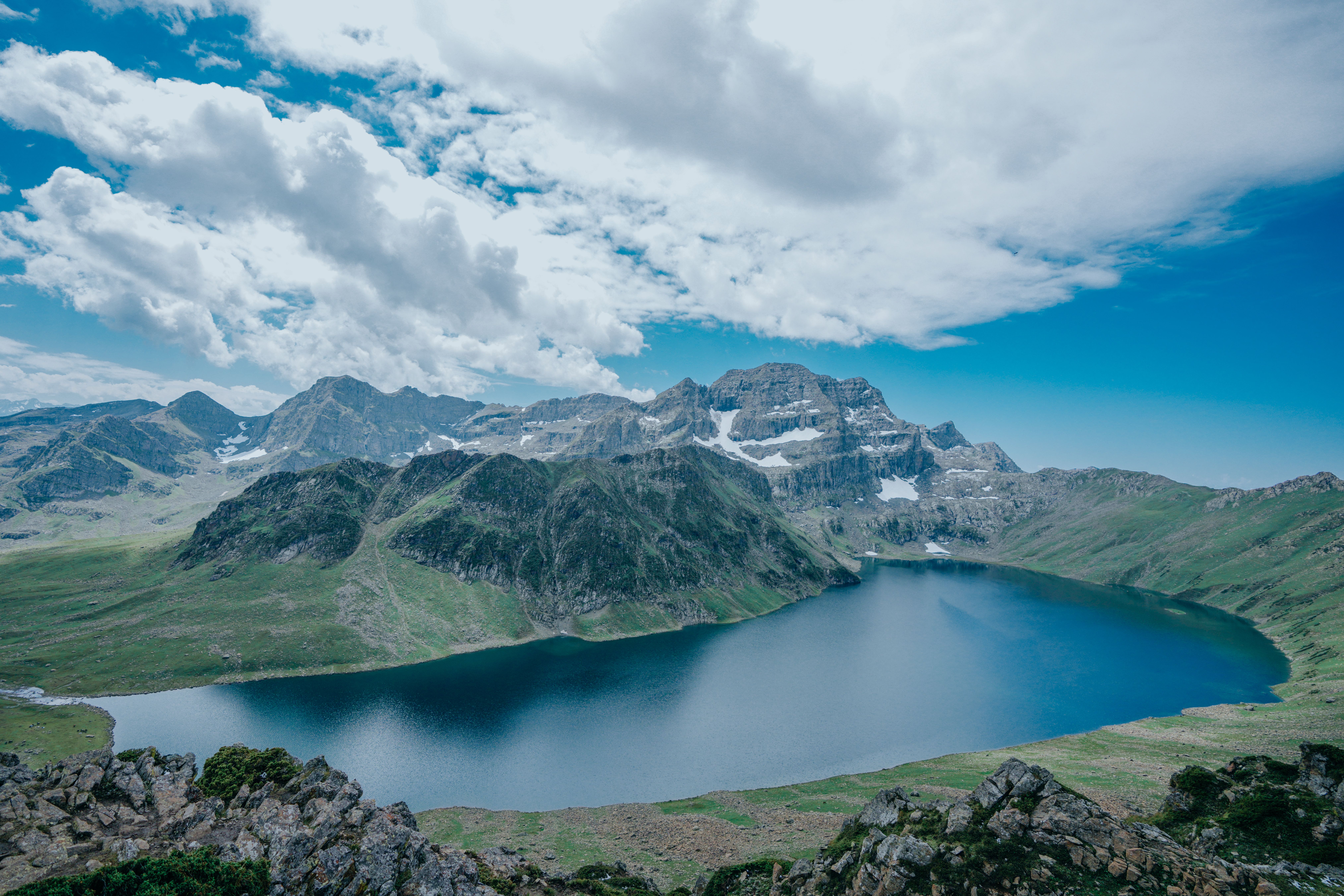 A Beautiful Lake Surrounded by Green Mountains Under Blue Sky · Free ...