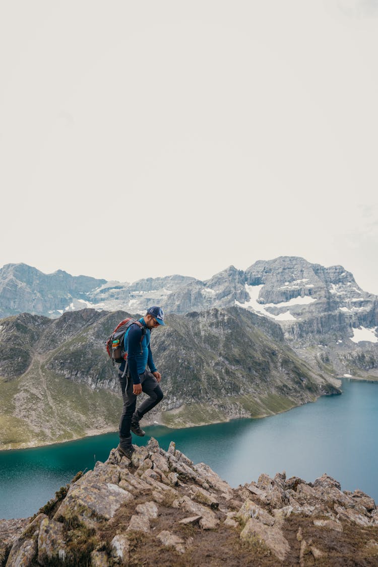 Man On Top Of The Cliff