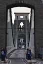 People Walking on Brown Brick Bridge