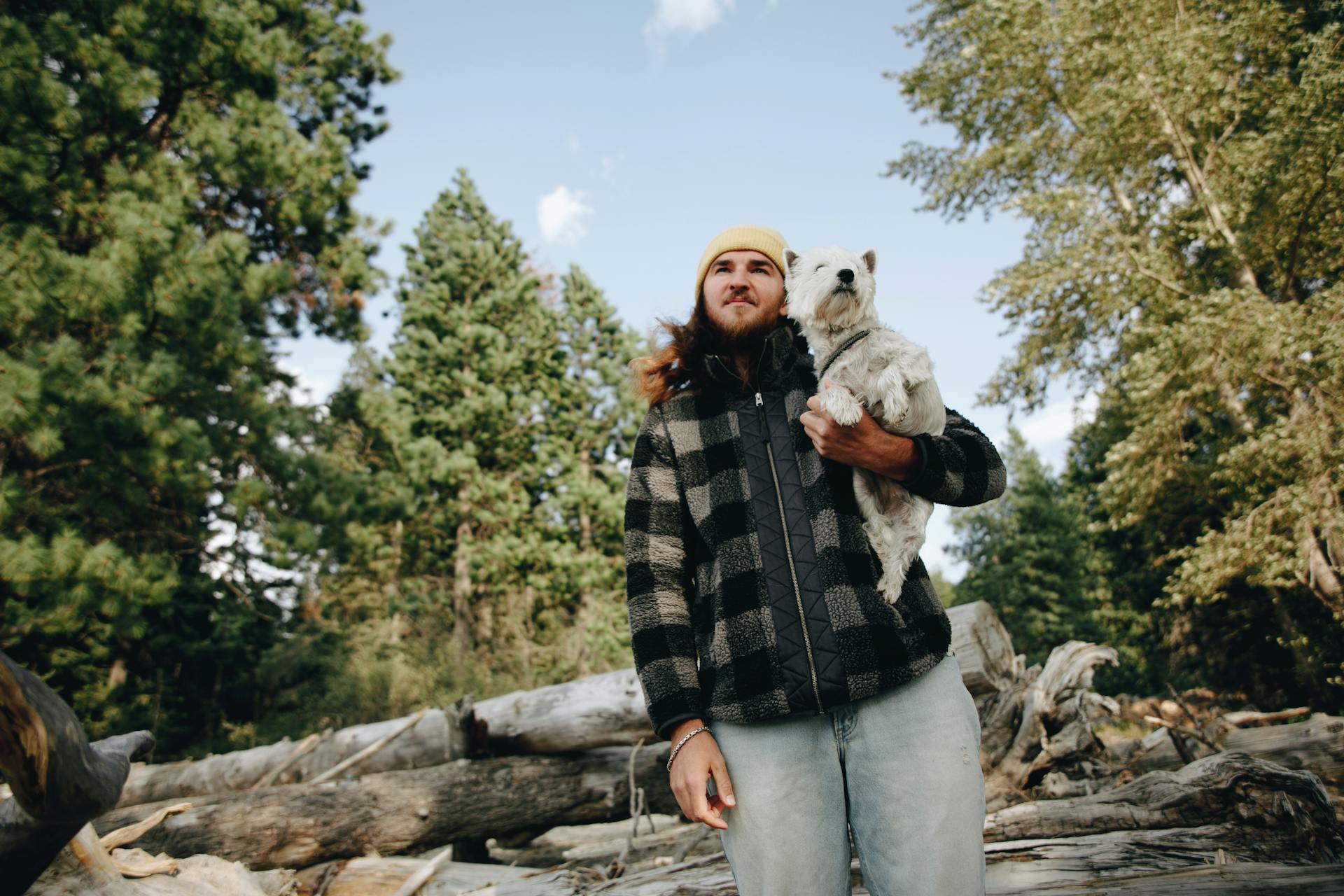 A Man Holding a Dog