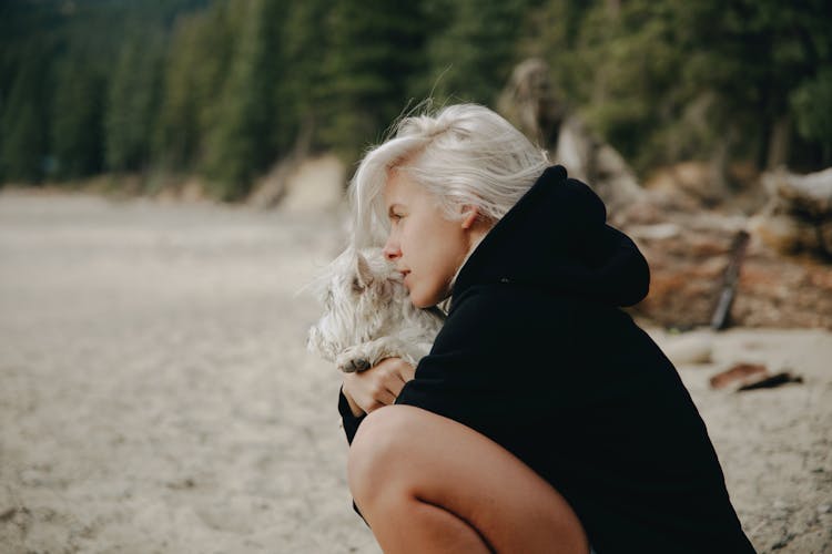 Woman Hugging A Dog