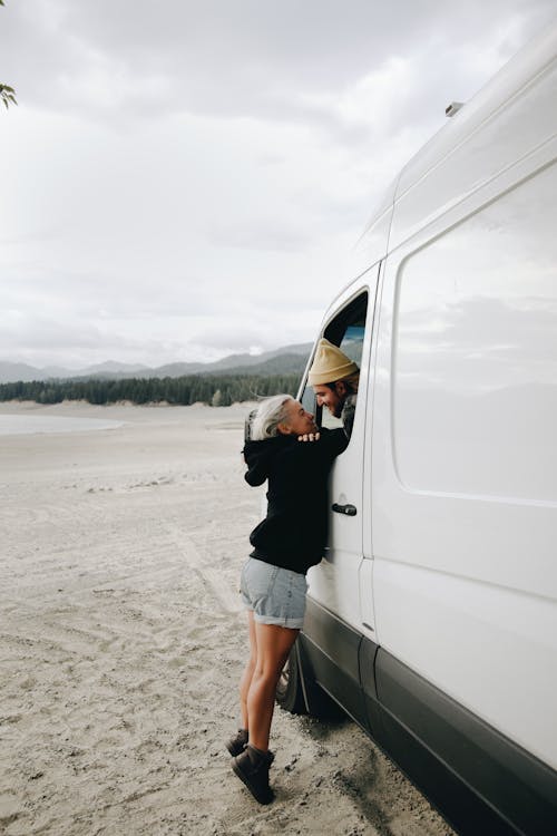 Free A Couple with a Camper Van Stock Photo