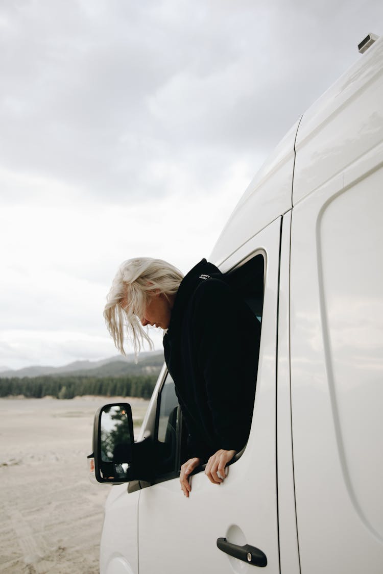 Woman Looking Out Van Window