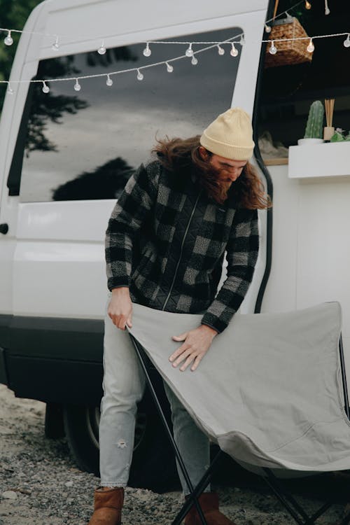 A Man Standing by an RV