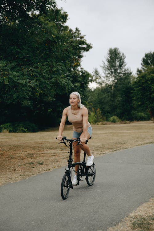 A Woman Riding a Bicycle at the Park