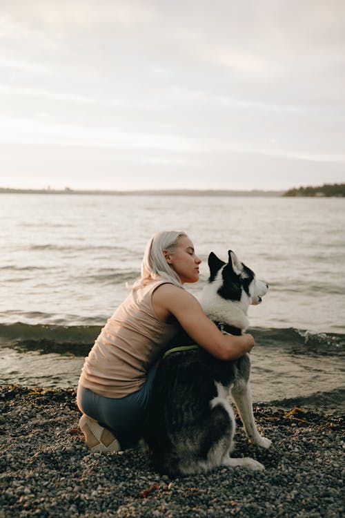Woman Hugging Her Dog