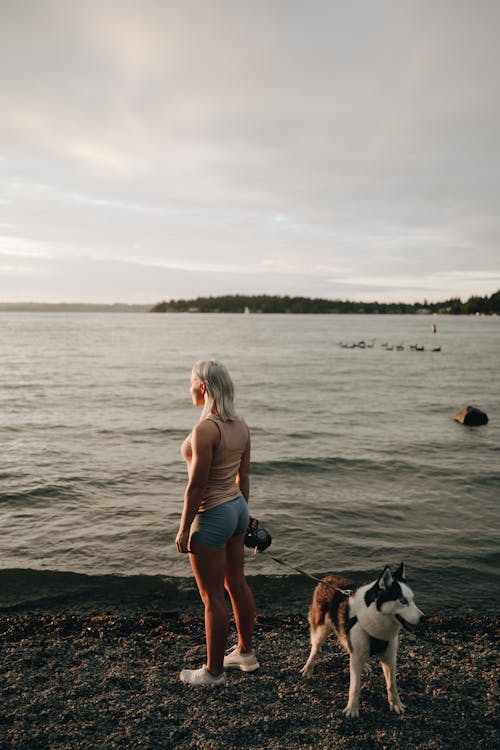 Woman with Dog on Beach