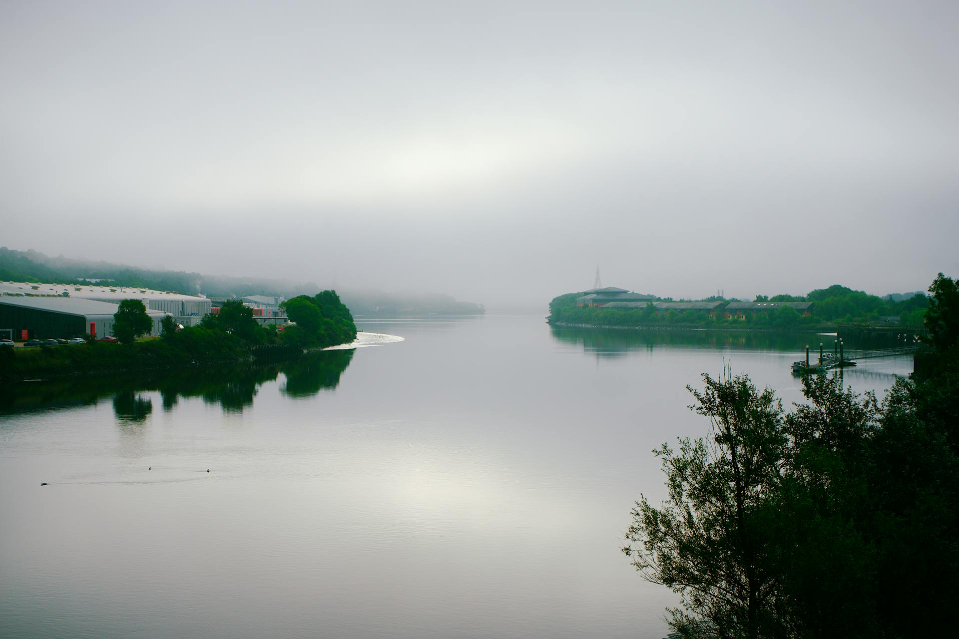 A foggy morning view of the tranquil River Tyne in Newcastle upon Tyne, England.