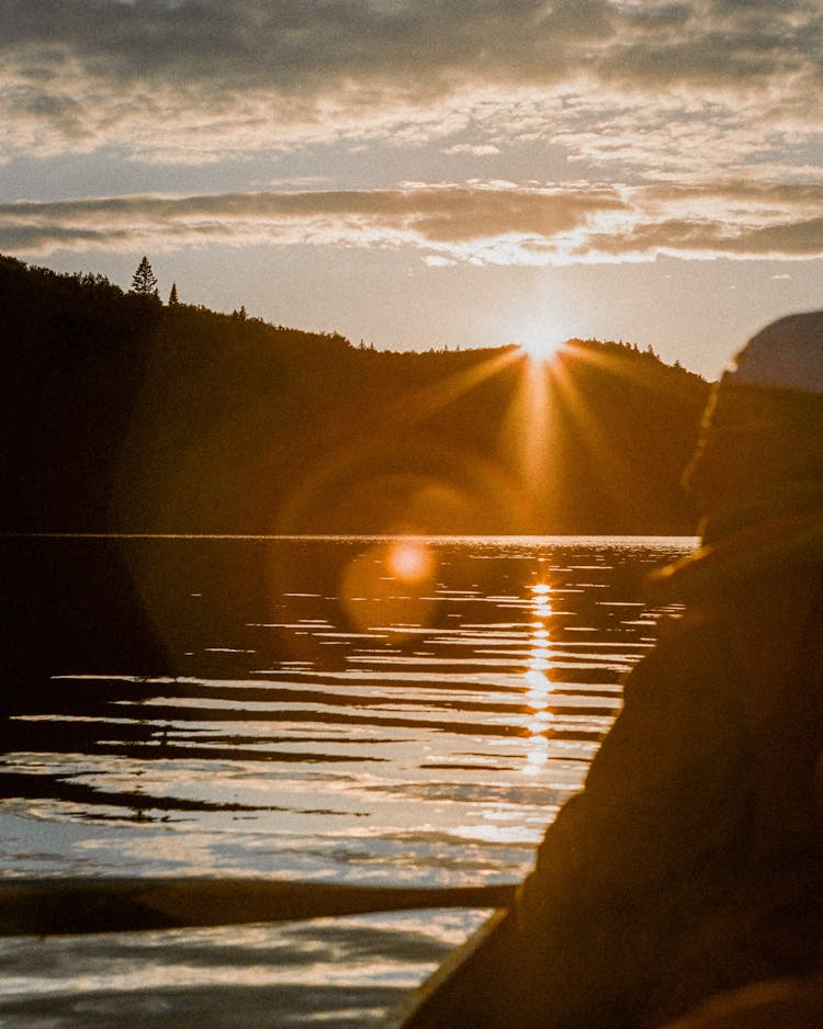 Sunset Over Lake And Mountains