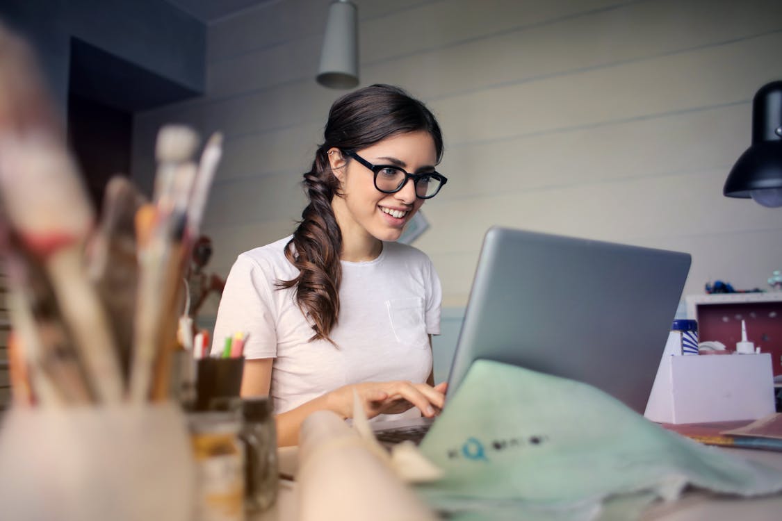 Free Photo of Woman Using Her Laptop Stock Photo