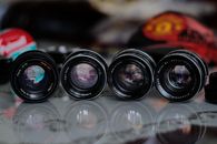 Black Camera Lenses on Shiny Surface