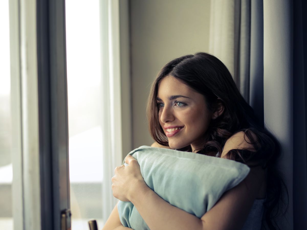 Client sitting by a window at home