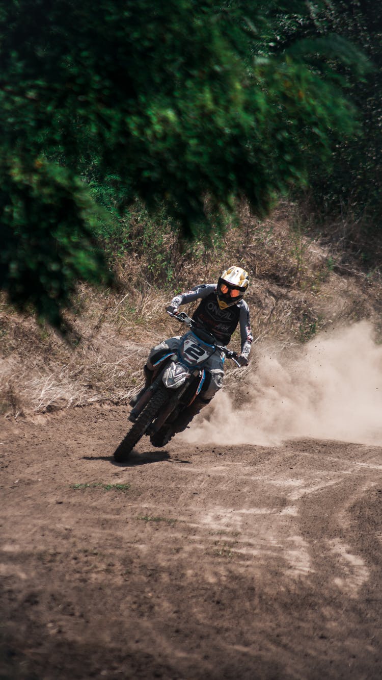 Motocross Racing On A Gravel Road 