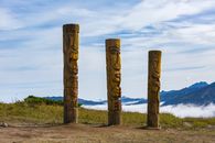 Brown Wooden Post on Green Grass Field