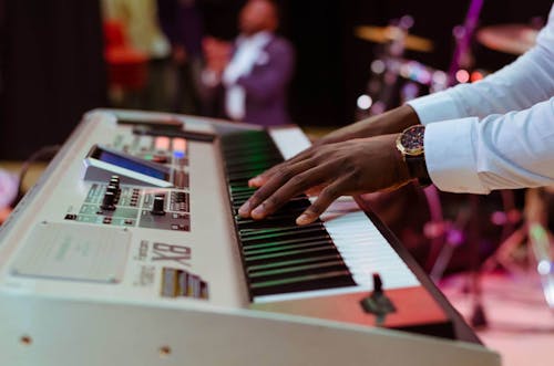 Photo of a Person Playing Electronic Keyboard