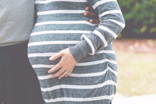 Free Gray and White Striped Maternity Dress Stock Photo