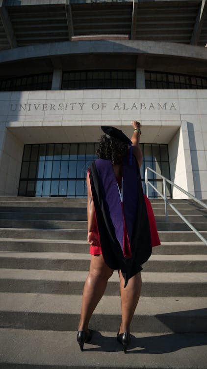 Free Woman Standing in Front of University of Alabama Stock Photo