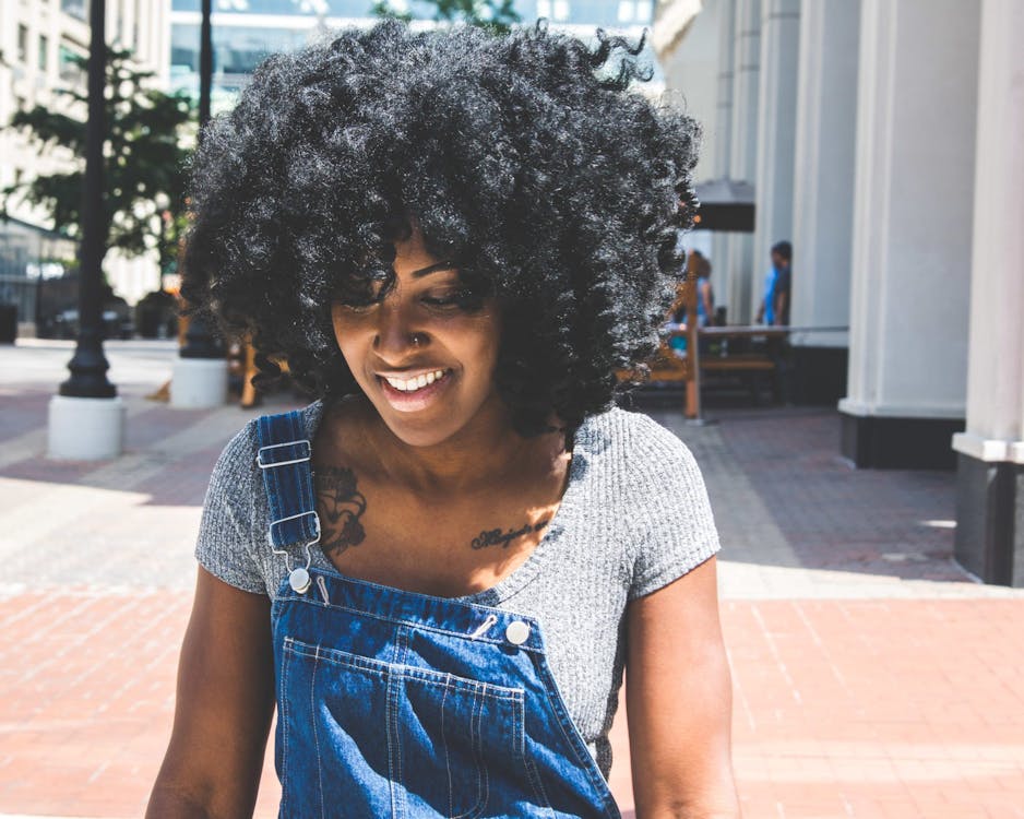 Woman in Gray Scoop-neck Shirt and Blue Denim Overalls