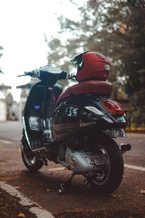 Red and Black Scooter on Road