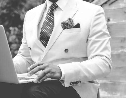Free Grayscale Photo of Man Wearing White Suit Jacket Stock Photo