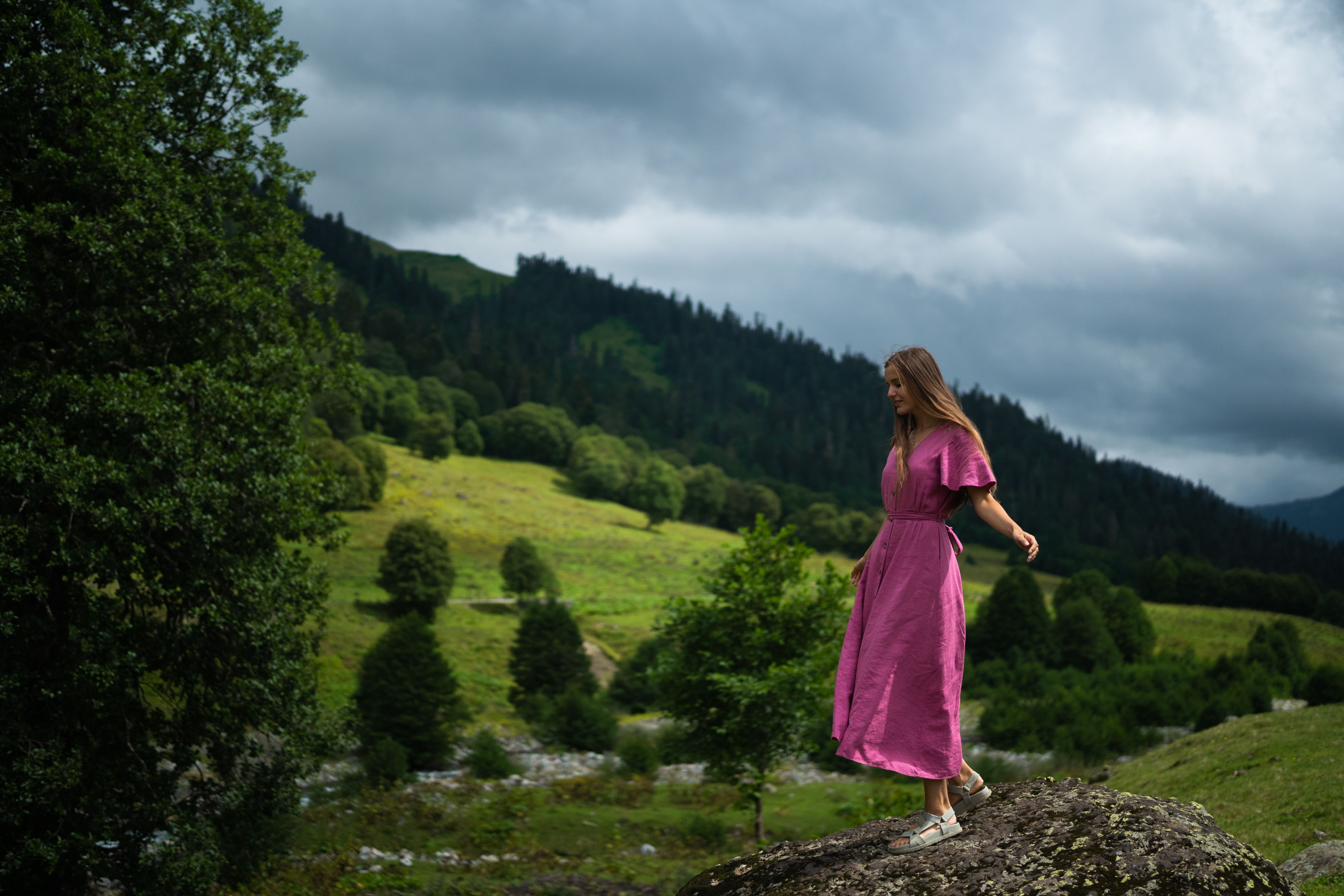 Woman in Purple Dress Standing on a Rock · Free Stock Photo