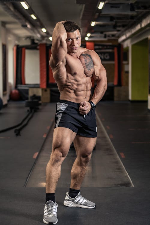A Bodybuilder Flexing His Muscular Body