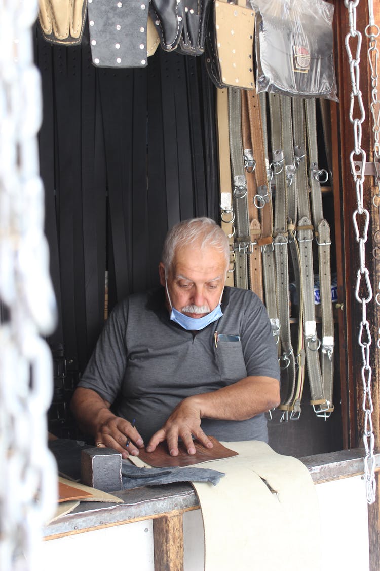 Man In Store With Belts