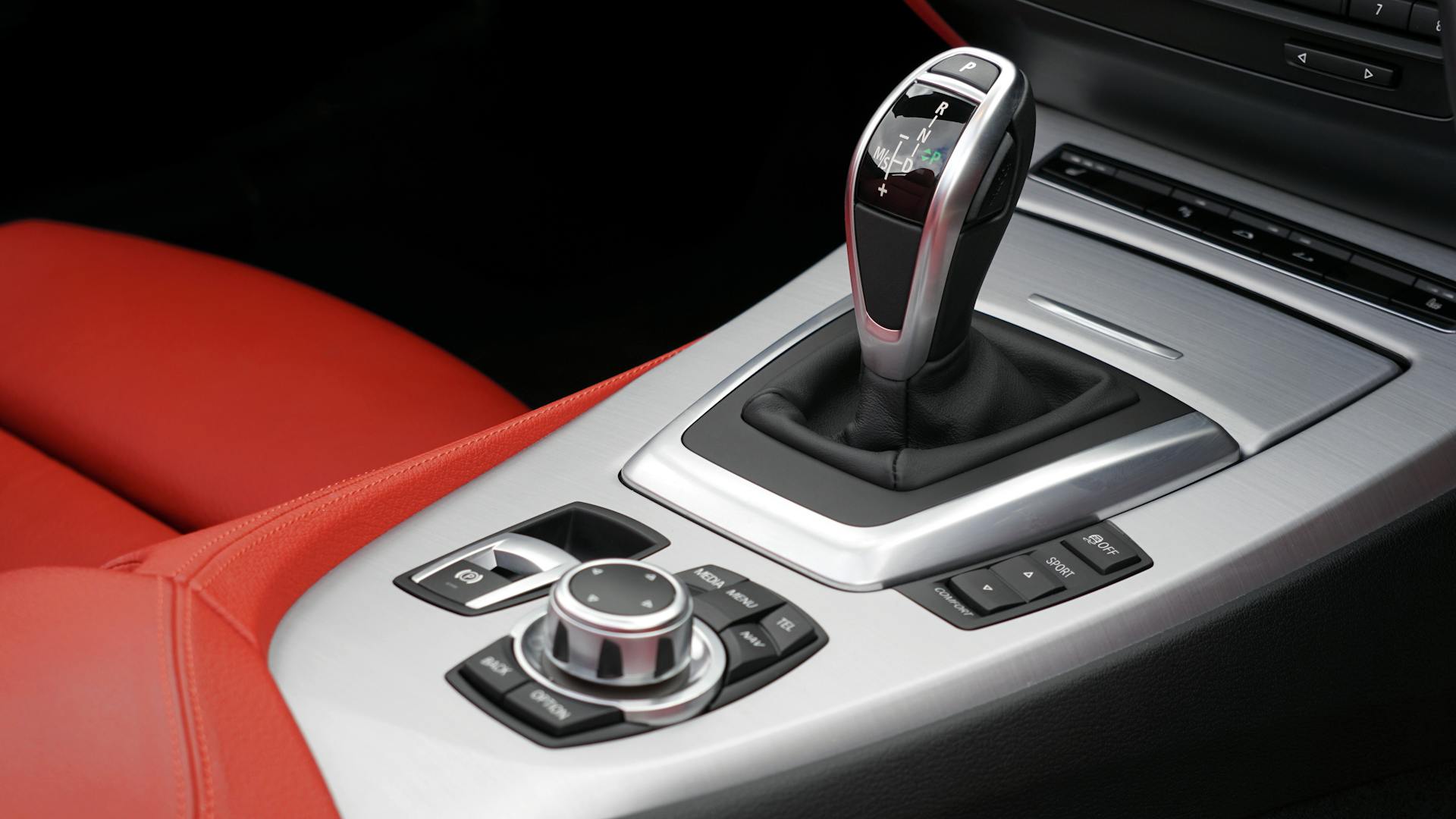 Close-up of BMW Z4 interior showcasing the gear shift and control panel.