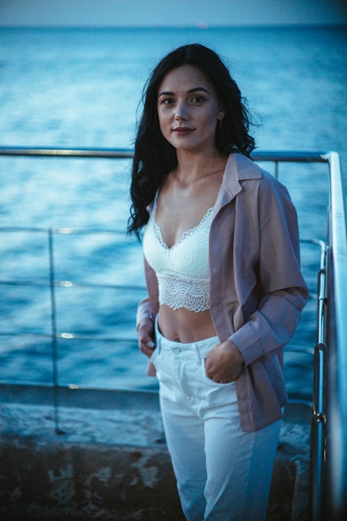 Beautiful Woman Standing on a Dock