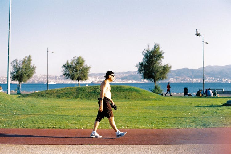 Elderly Man Walking Shirtless