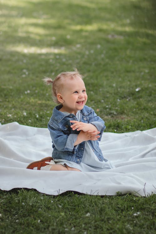 Photo of a Cute Kid in a Denim Jacket 