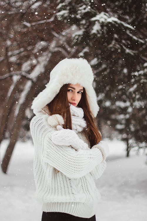 Shallow Focus of a Beautiful Woman in White Winter Clothes