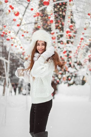 White sweater dress with tan boots