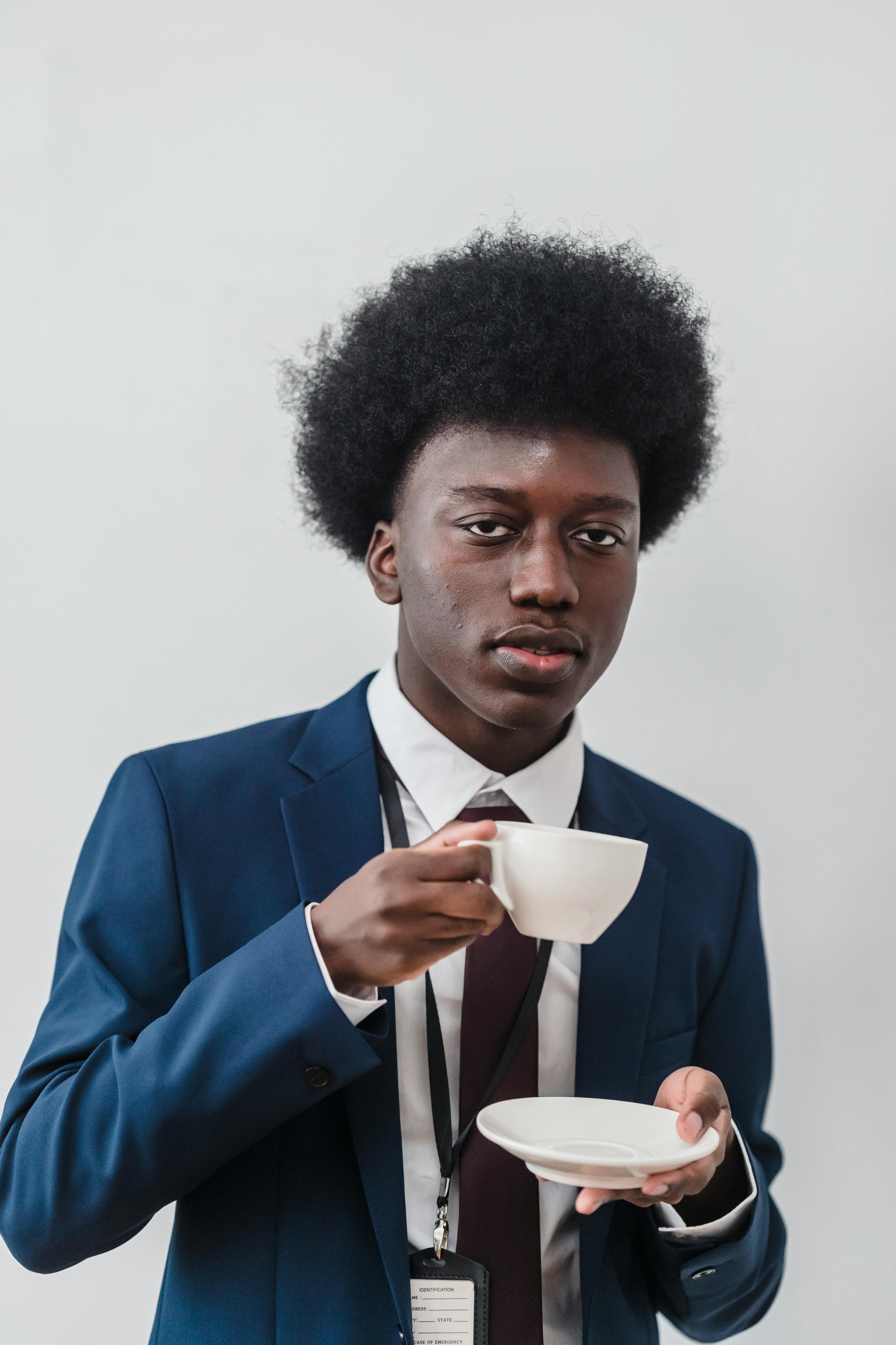 Man in blue suit jacket and black pants photo – Free Chicago Image