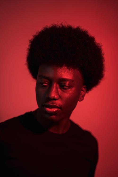Free A Man with an Afro in a Black Shirt Stock Photo